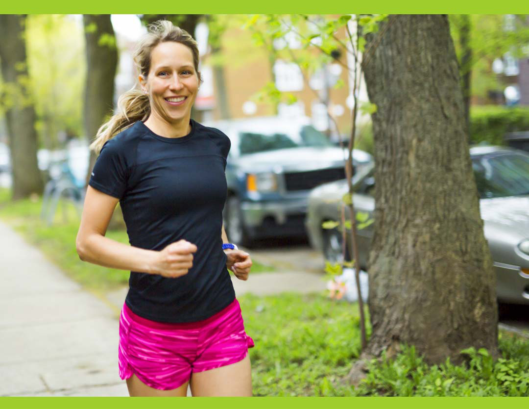 happy woman runner in neighborhoos