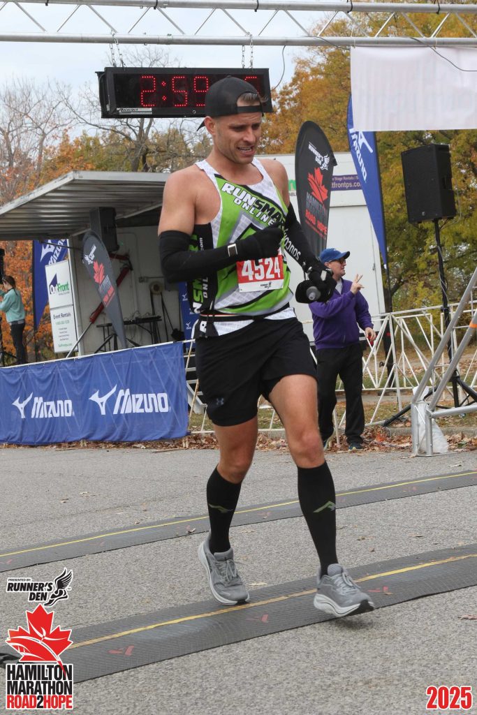 Crossing the finish line at the Hamilton Marathon